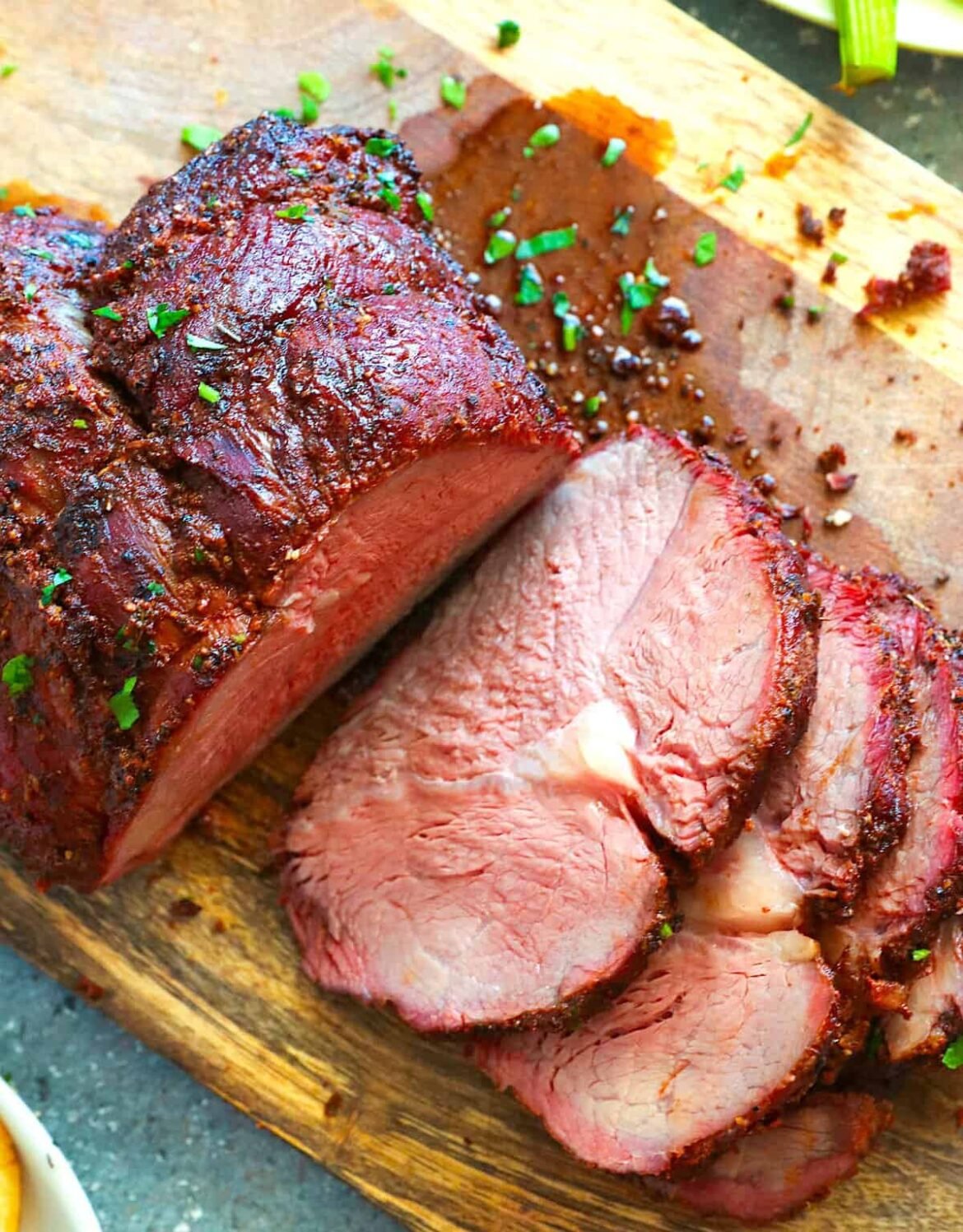 Slicing into a rested and smoked sirloin tip roast for an easy dinner.