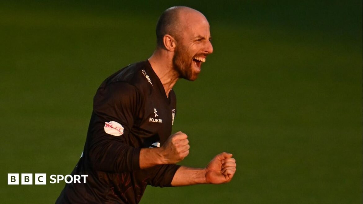 Jack Leach, wearing Somerset's black T20 shirt, celebrates taking a wicket against Worcestershire