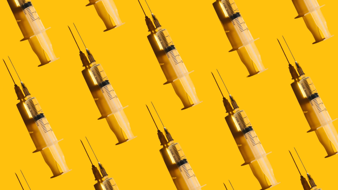 Pattern of syringes with a vaccine on yellow background. Concept of medical treatment or vaccination.