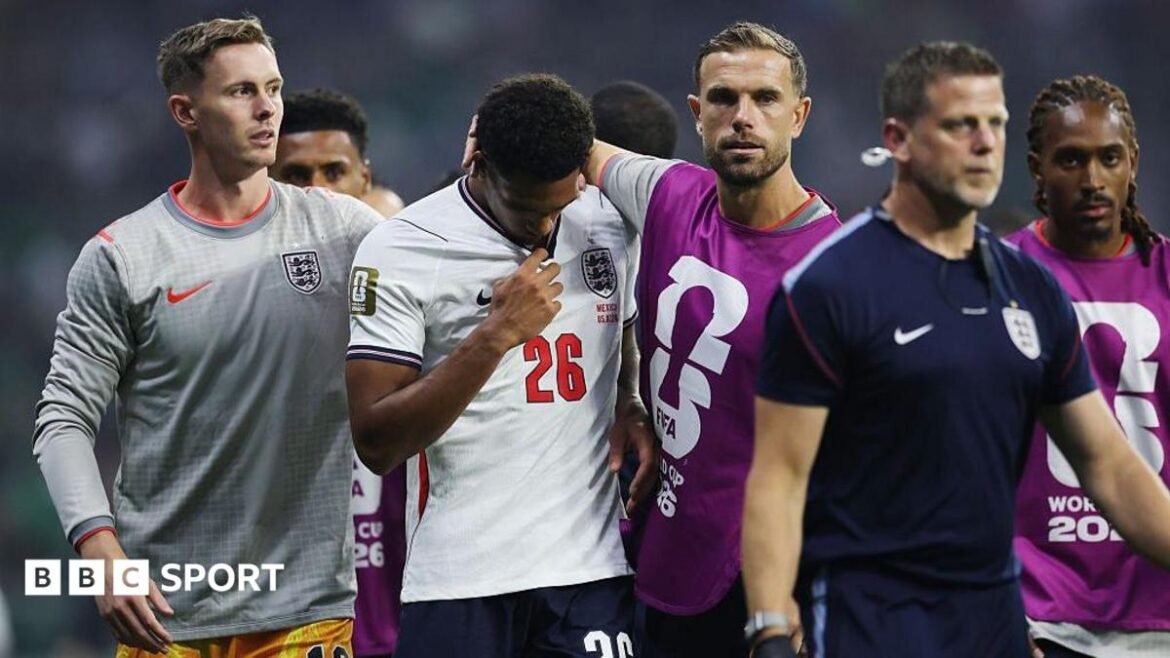 Jarell Quansah walks off the pitch with his head down after receiving a red card against Mexico