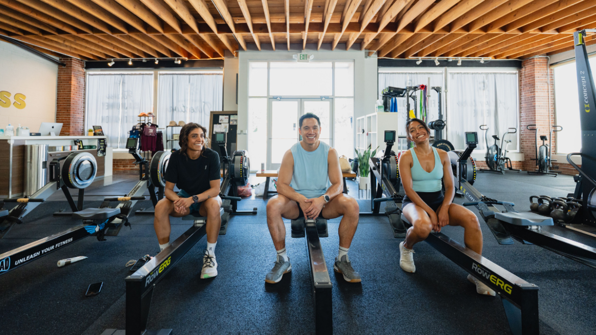 Three Athletes Sitting In A Gym, Training For An Upcoming Hyrox Race.