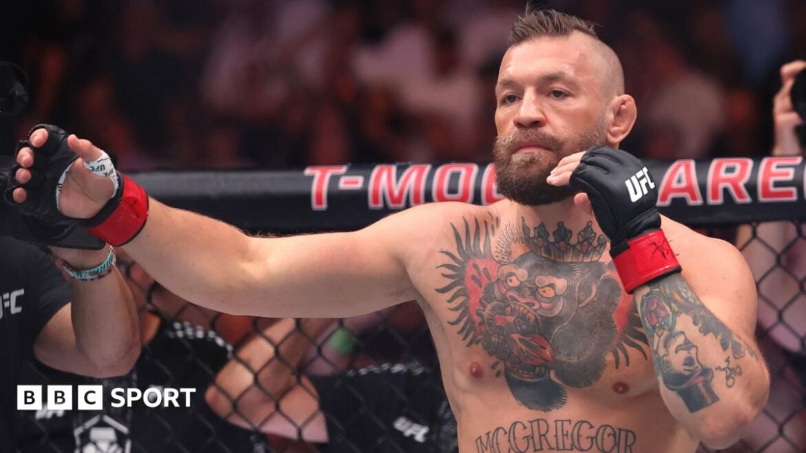Conor McGregor of the Republic of Ireland participates in the walkout prior to facing Max Holloway of the United States in their welterweight bout during UFC 329