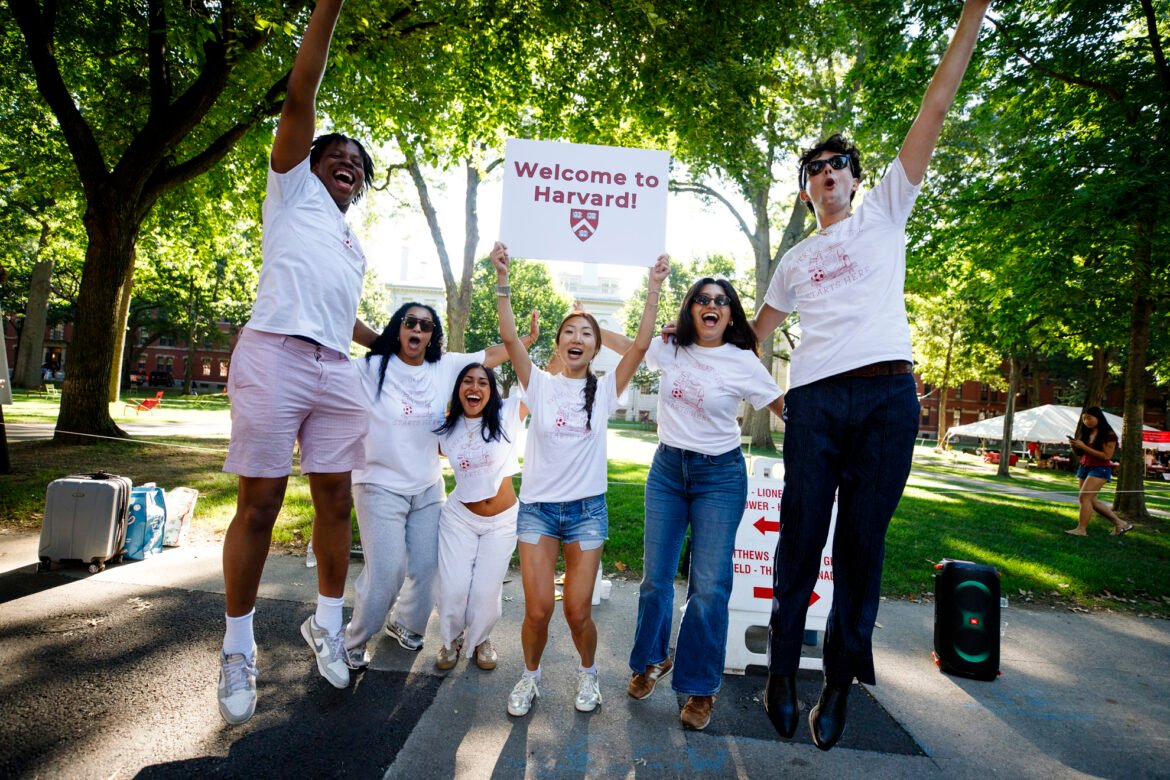 Members of the Crimson Key Society welcome first-year students to Harvard.