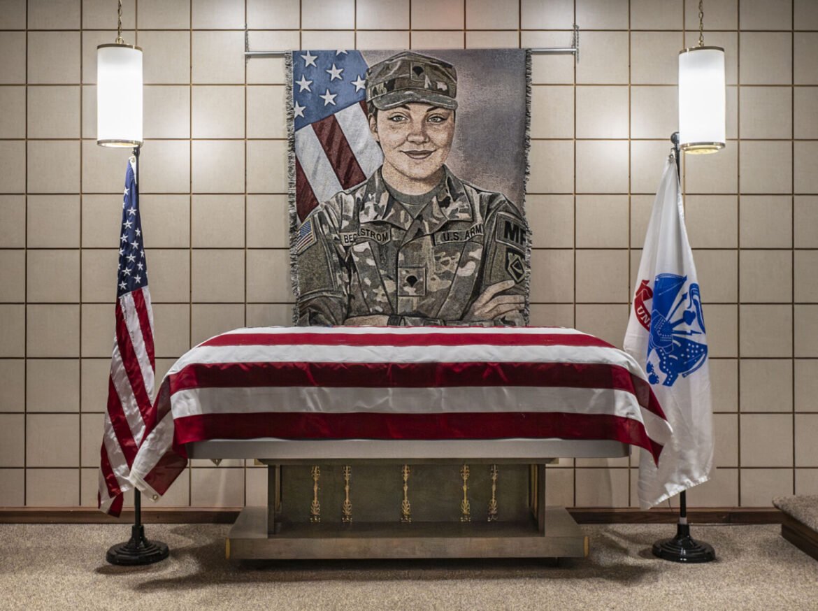 A federal judge will allow the Department of Justice to begin force-feeding the man charged with the shooting last November of Army Spc. Sarah Beckstrom, a member of the West Virginia National Guard. Beckstrom's casket is displayed at a funeral home in her hometown of Webster Springs, West Virginia, on Dec. 5, 2025. (Photo courtesy of the Department of Defense)