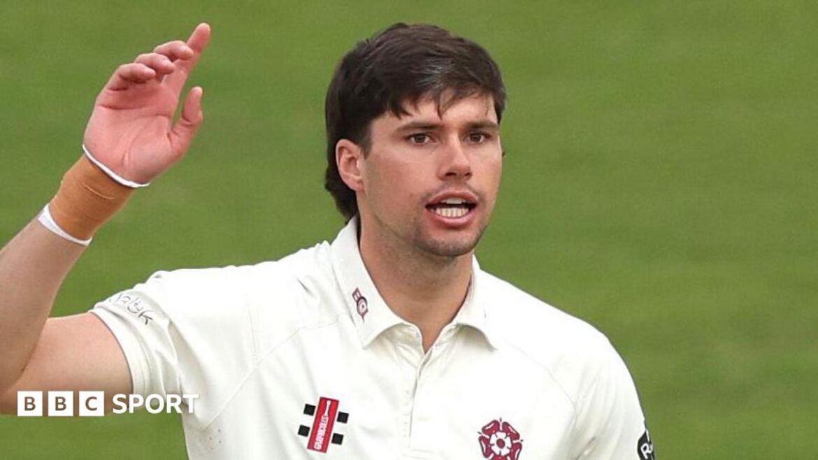 Justin Broad in a white Northamptonshire jersey during a match