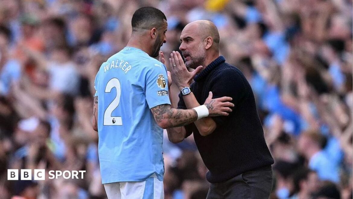 Kyle Walker and Pep Guardiola have a discussion on the touchline.