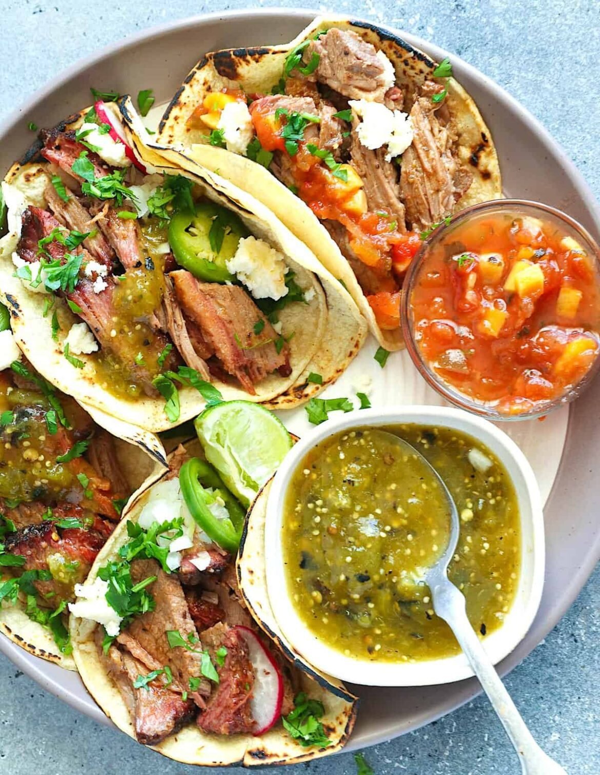 Enjoying Mexican street food vibes with a Texas twist in the form of smoked brisket tacos.