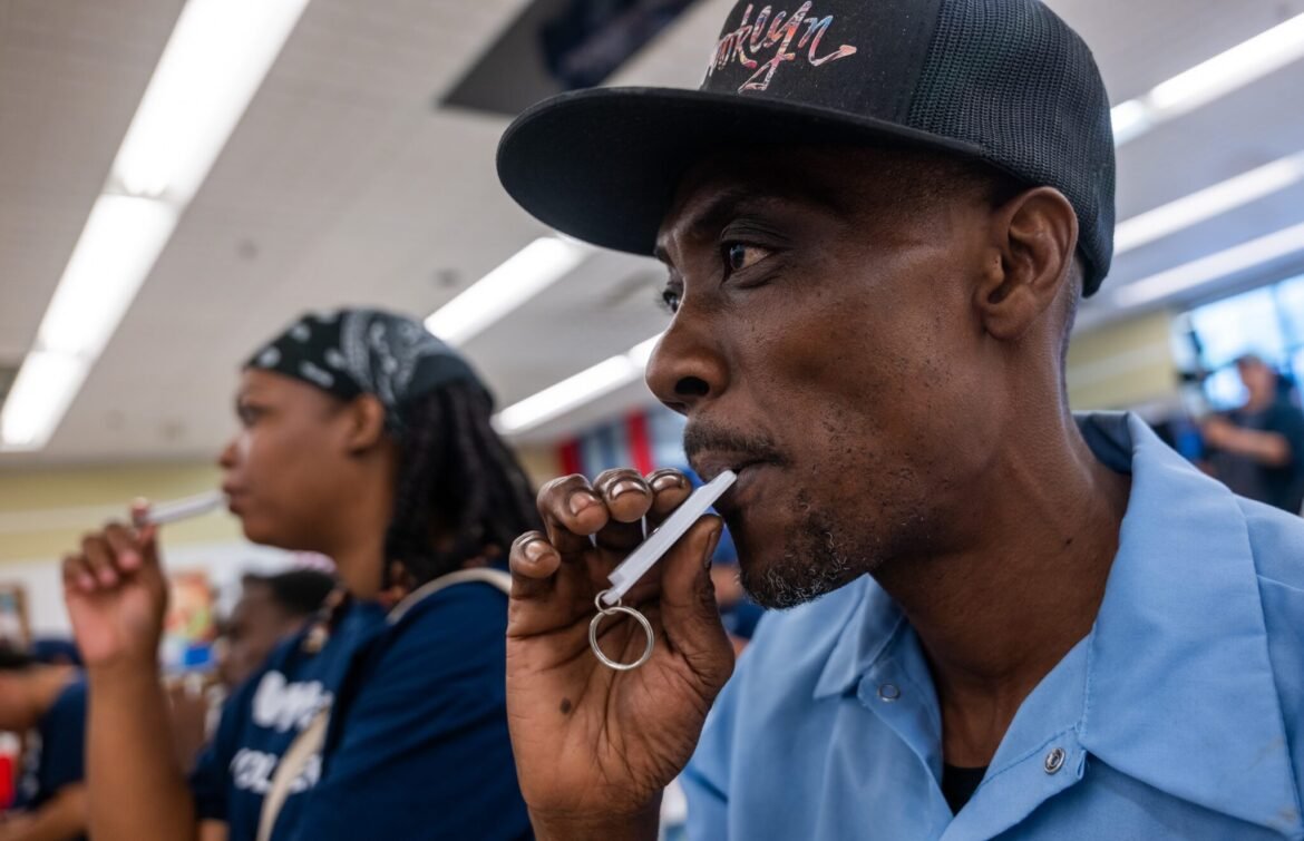 Haitians living in Brooklyn learn to use a whistle to blow if Immigration and Customs Enforcement agents arrive in their neighborhood during an Immigrant Resource Fair and Know Your Rights Event in an area of Brooklyn known as "Little Haiti" on July 28, 2026, in New York City. (Photo by Spencer Platt/Getty Images)