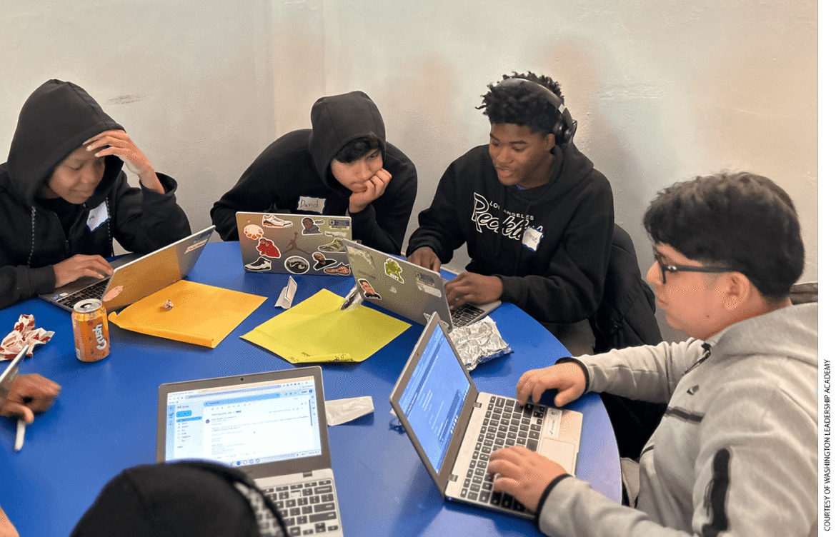 Washington Leadership Academy students Drake, David, Terrance, and Bryan collaborate to construct an AI bot that has real-world application during the D.C. charter high school’s annual “Hackathon” last winter.