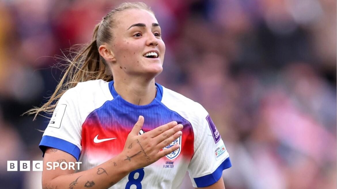 Georgia Stanway pats her chest in celebration