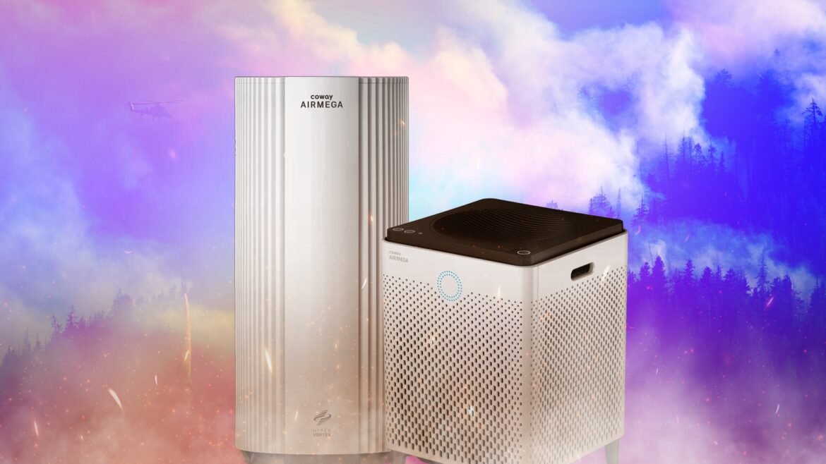 Two air purifiers on a gradient background with wildfire smoke in the background