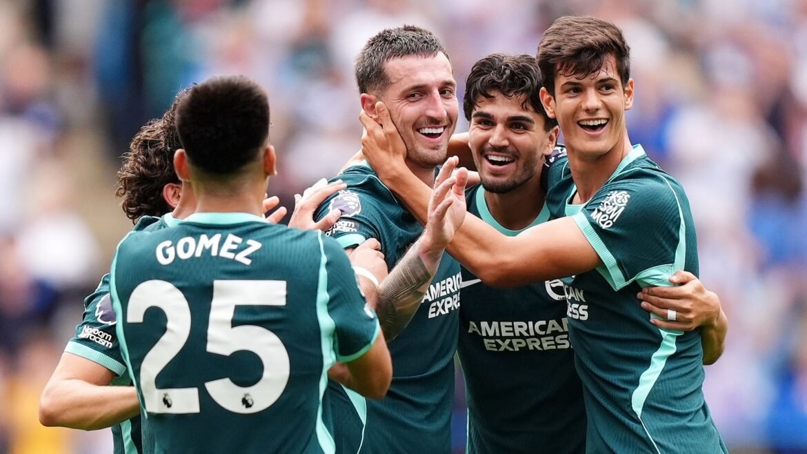 Brighton's Lewis Dunk celebrates with team-mates after scoring their fourth goal 