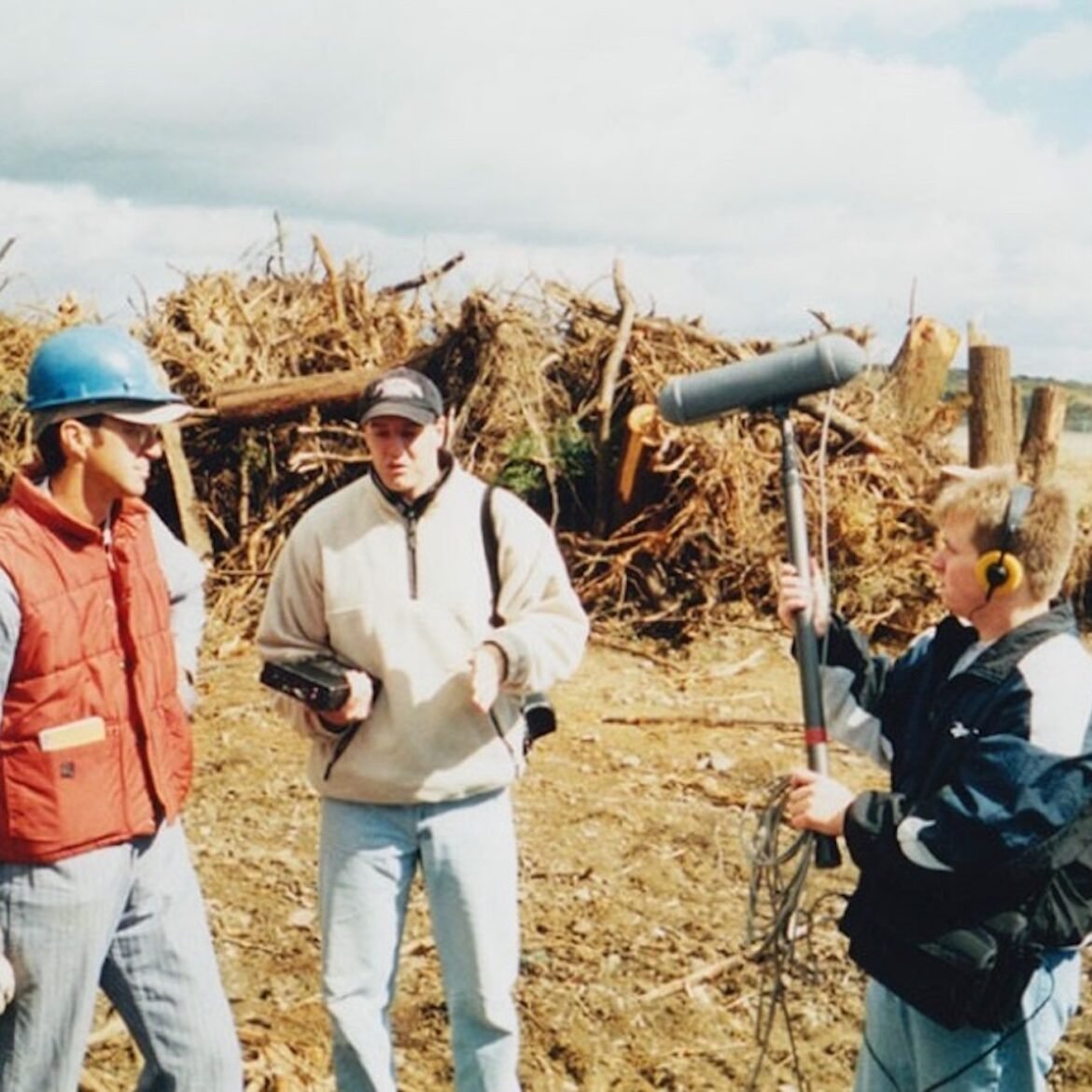 Tim Lambert, center, interviews Somerset County Coroner Wallace Miller, left. Former WITF News Director Damon Boughamer on the right records the conversation at the Flight 93 crash site on Oct. 6, 2001. (Courtesy of Tim Lambert)