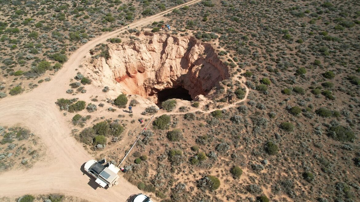 Giant caves beneath sinkhole reveal origin of mystery trenches that score Australia's Nullarbor Plain