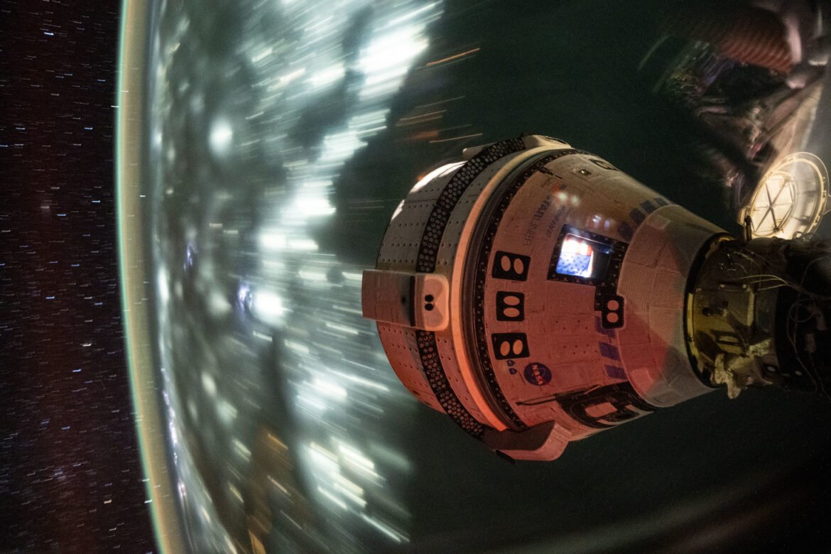 Boeing's Starliner spacecraft that launched NASA's Crew Flight Test astronauts Butch Wilmore and Suni Williams to the International Space Station is pictured docked to the Harmony module's forward port. This long-duration photograph was taken on July 3, 2024, from the orbital complex as it soared 256 miles above the Arabian Sea off the coast of Mumbai, India.