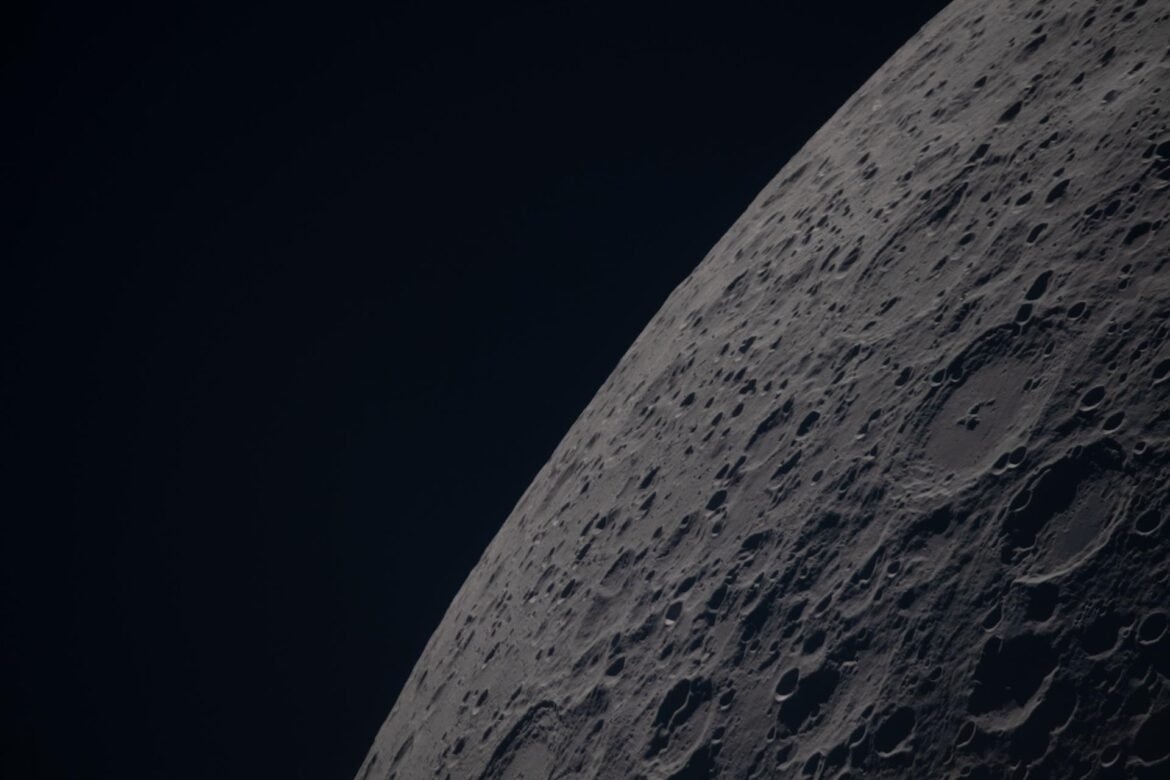 (April 6, 2026) – Poynting crater and Keeler crater are visible side by side in the lower right portion of this image of the Moon’s far side highlands. Poynting, positioned above, is a large impact crater with a well-defined rim and relatively smooth interior, indicative of material that has settled following the initial impact. Just below it, Keeler crater appears slightly smaller, with a sharply outlined rim and a more textured interior shaped by subsequent impacts and ejecta. Both features lie within the densely cratered far side highlands, preserving a record of ancient impacts that have shaped the lunar surface over billions of years.
