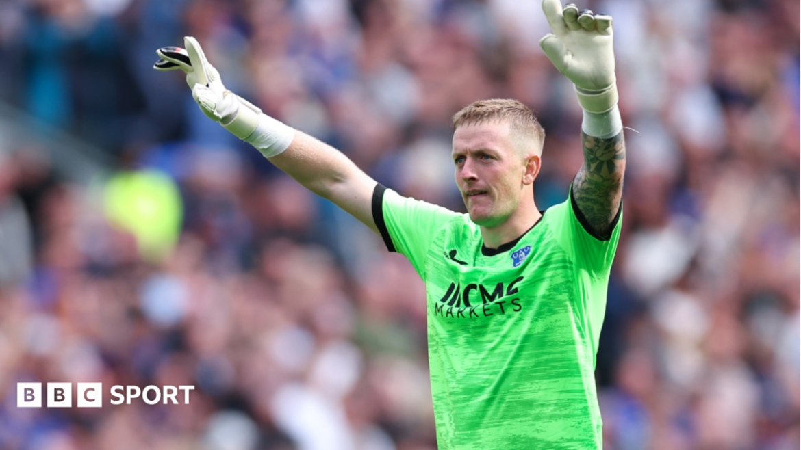 Everton's Jordan Pickford raises his hands
