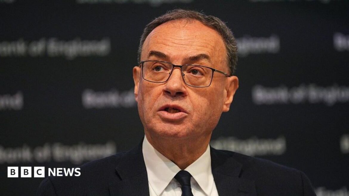 Governor of the Bank of England, Andrew Bailey, talks during a Bank of England Monetary Policy Report press conference. He is wearing a dark suit and tie.