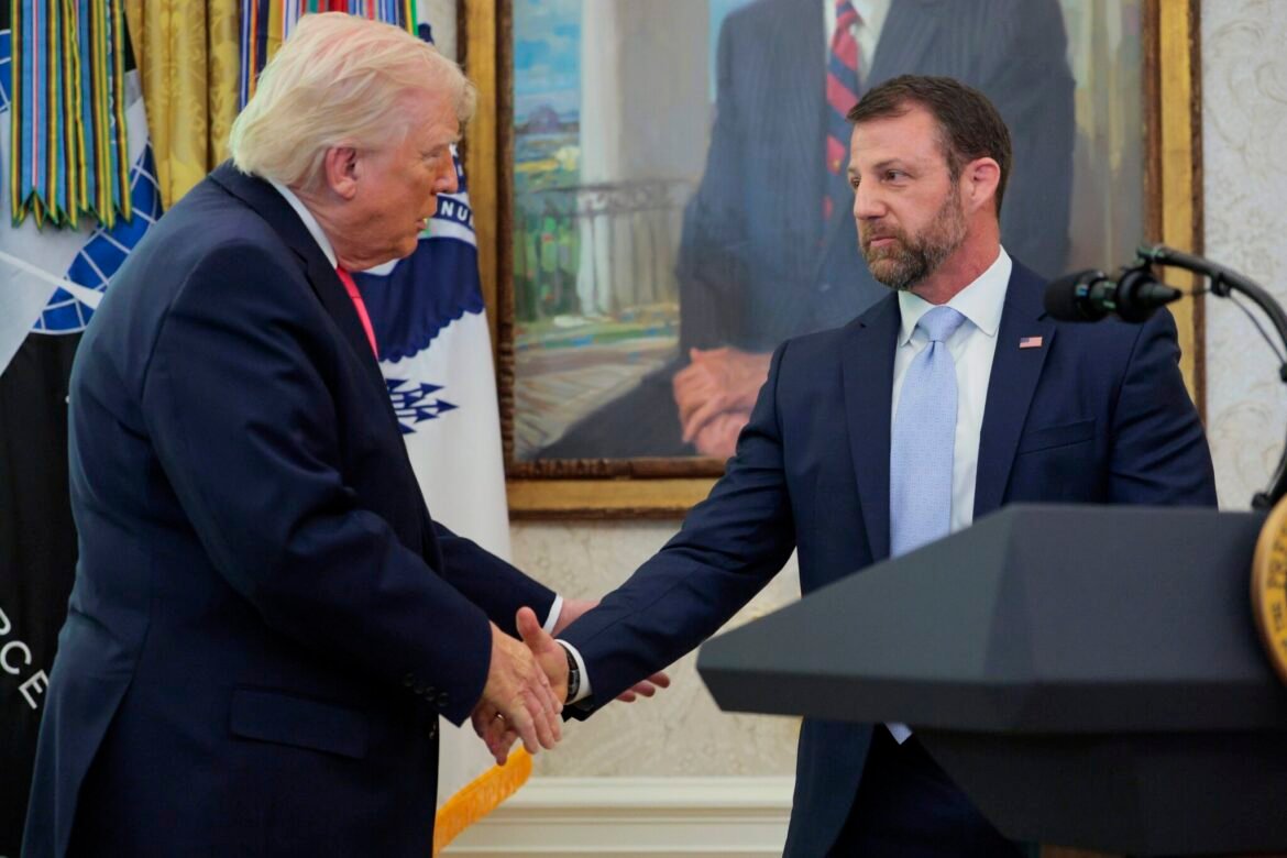 President Donald Trump shakes hands with newly sworn in Department of Homeland Security Secretary Markwayne Mullin during a ceremony in the Oval Office at the White House on March 24, 2026 in Washington, DC. (Photo by Chip Somodevilla/Getty Images)
