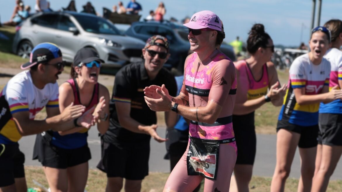Malachi Cashmore races with cheering fans behind him.
