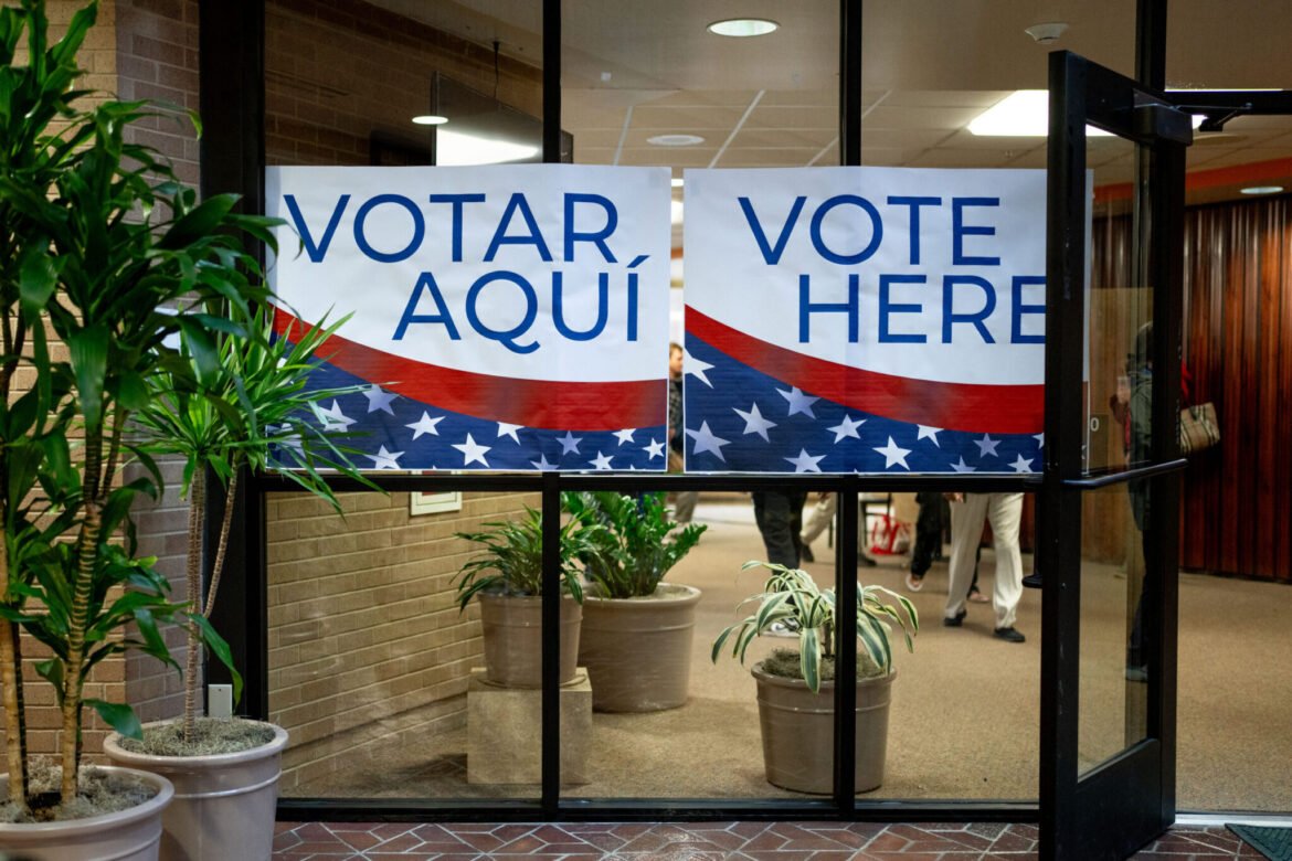 Signs in English and Spanish direct voters to the polls at the Salt Lake County Government Center in Salt Lake City on Tuesday, Nov. 5, 2024. (Photo by Spenser Heaps for Utah News Dispatch)