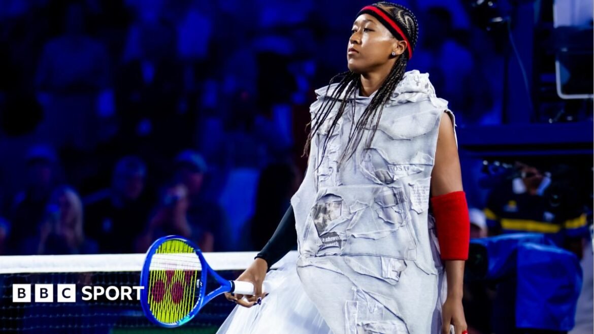 Naomi Osaka wears a red-and-black headband and elbow sleeves similar to those worn by Allen Iverson