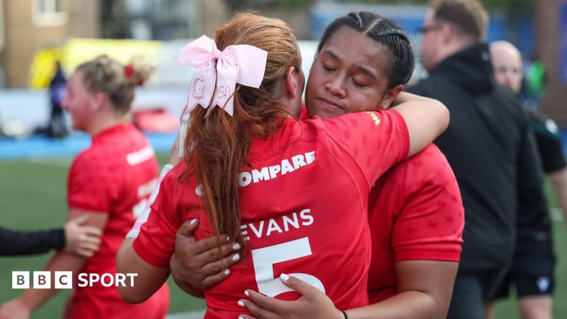 Sisilia Tuipulotu hugging Georgia Evans after defeat by USA