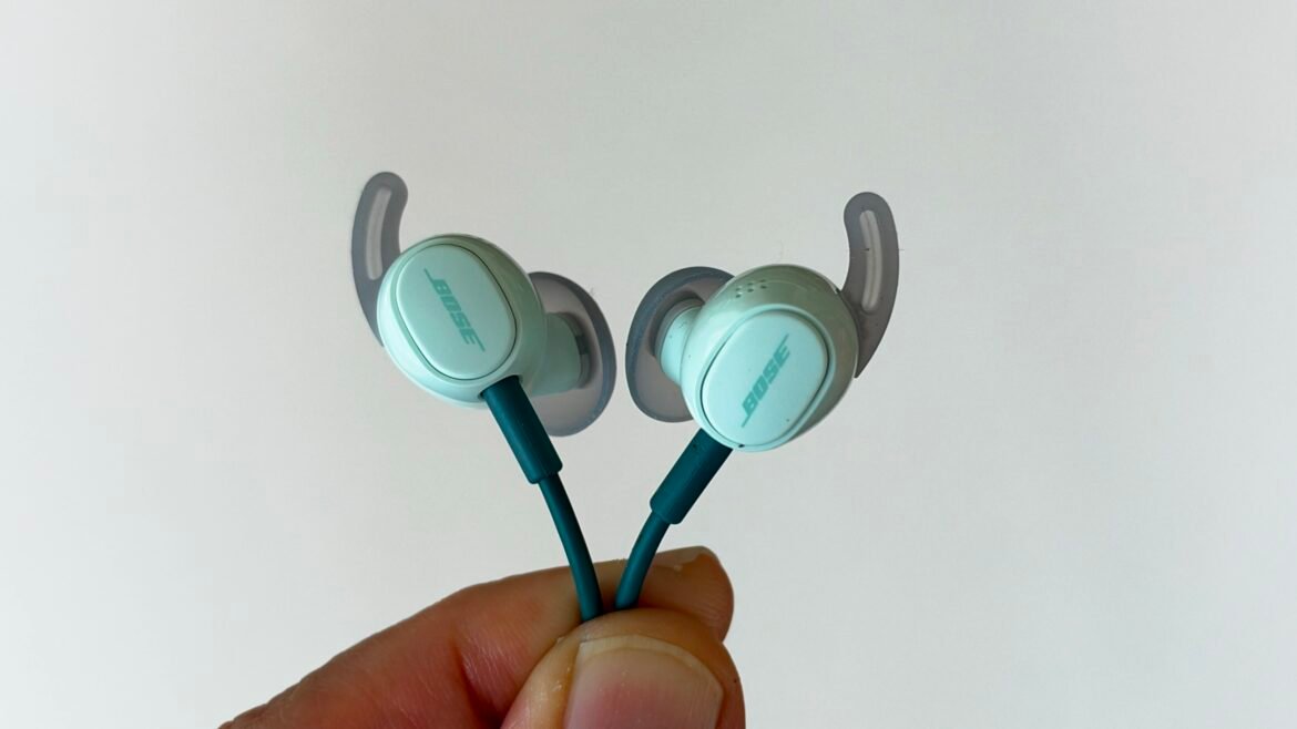 Close up Bose's Noise Cancelling Wired Earbuds in their limited edition mint color.