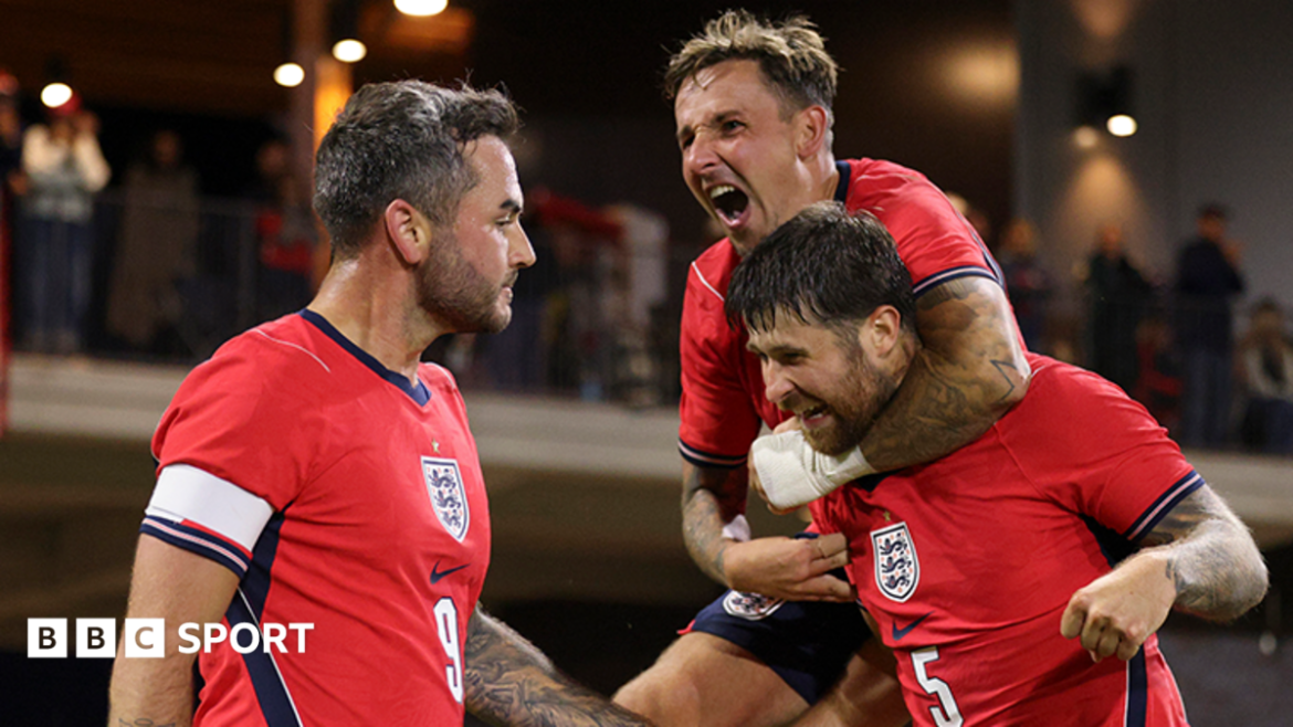 England's cerebral palsy team celebrate scoring a goal