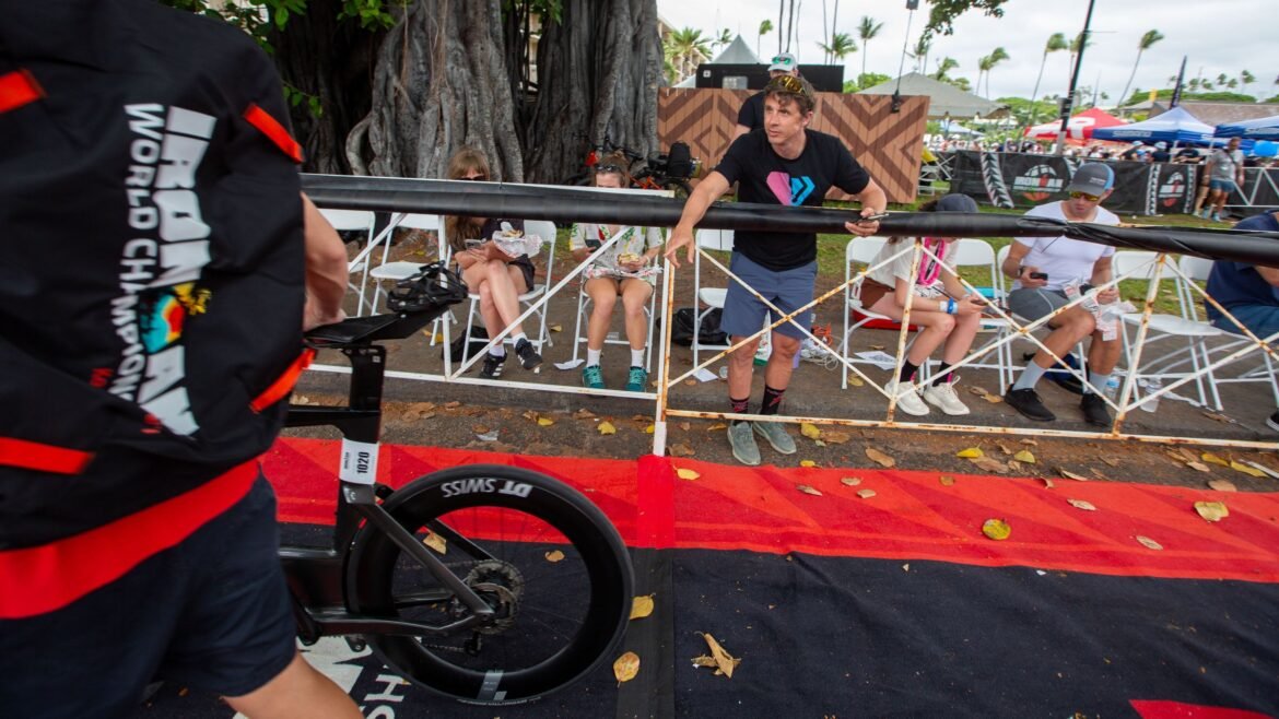 TJ Tollakson counts power meters at the 2026 Ironman World Championship bike check in.