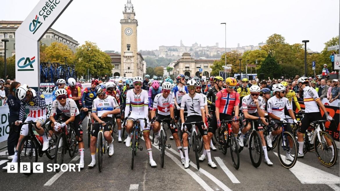 Riders at the Giro di Lombardia stage a protest prior to the start of the race