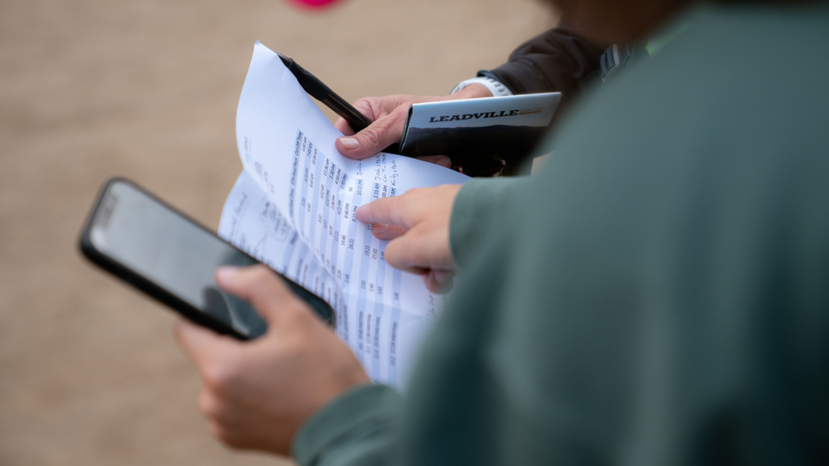 Athlete And Coach Reviewing A Training Plan And Discussing Goals.