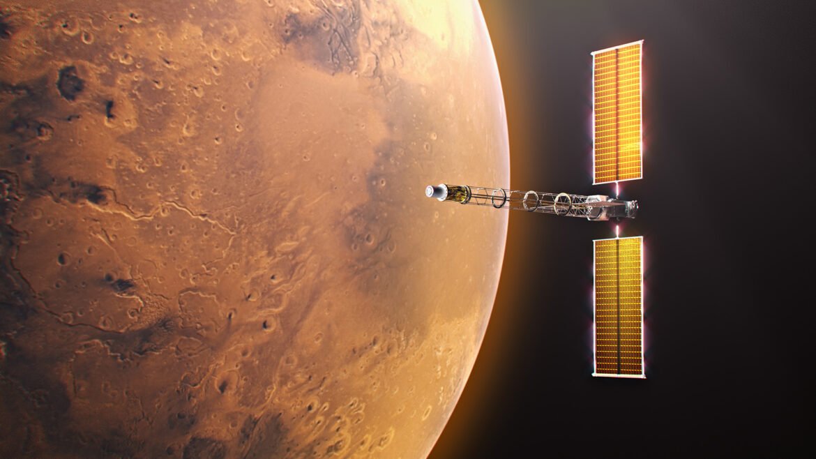 Digital illustration of the Space Reactor-1 (SR-1) Freedom spacecraft in orbit near Mars. The planet's red terrain fills the left half of the frame. On the right, the spacecraft is oriented horizontally, showcasing its central Power and Propulsion Element bus flanked by two tall, illuminated golden Roll-Out Solar Arrays. An elongated open-truss boom extends forward from the bus, ending at the cylindrical nuclear fission reactor and power conversion module.