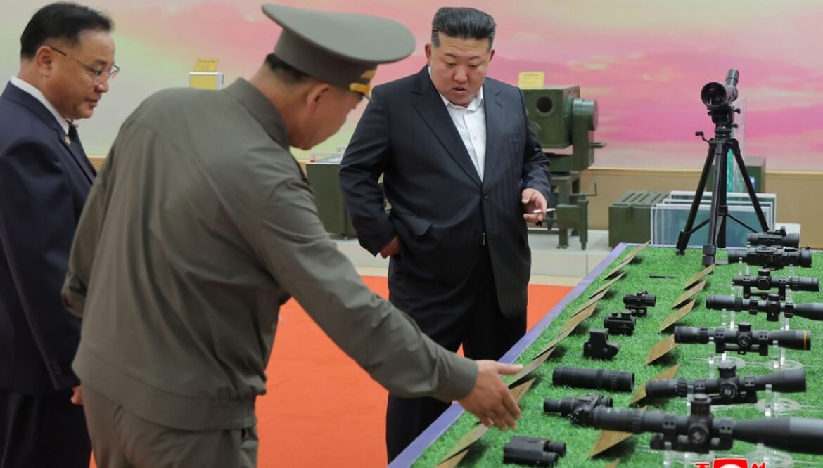 North Korea releases photos of Kim Jong Un at clothing expo after death rumors