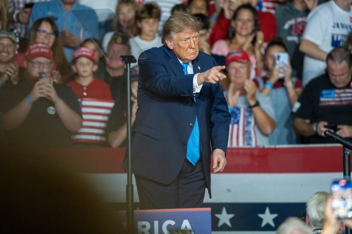 President Donald Trump points into the crowd after headlining a midterms rally in Grand Island, Nebraska, on Oct. 5, 2026, at the Nebraska State Fairgrounds, with thousands in attendance. (Photo by Zach Wendling/Nebraska Examiner)