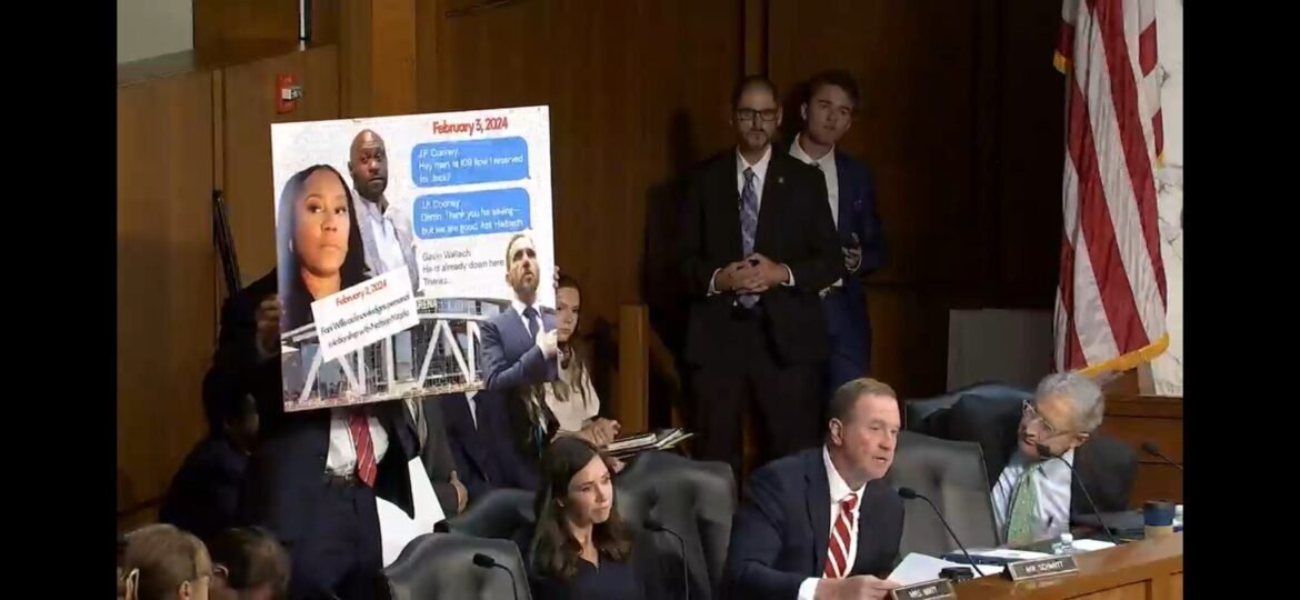 Sen. Eric Schmitt, R-Mo., speaks during a U.S. Senate Judiciary Committee hearing while a poster is displayed purporting to show text messages between former special counsel Jack Smith and security personnel about his attendance at an Atlanta Hawks NBA game. Smith actually had attended a University of Iowa Hawkeyes women's basketball game. (Screenshot from Judiciary Committee webcast)