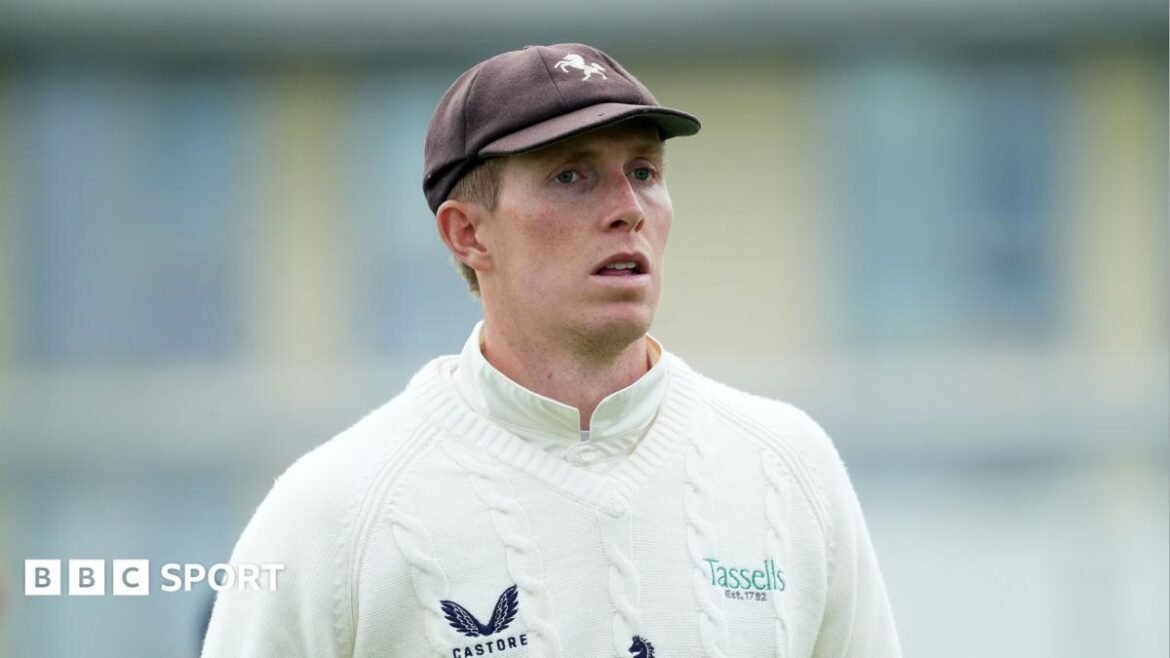 Zak Crawley walking on the pitch during a County Championship match for Kent in 2026