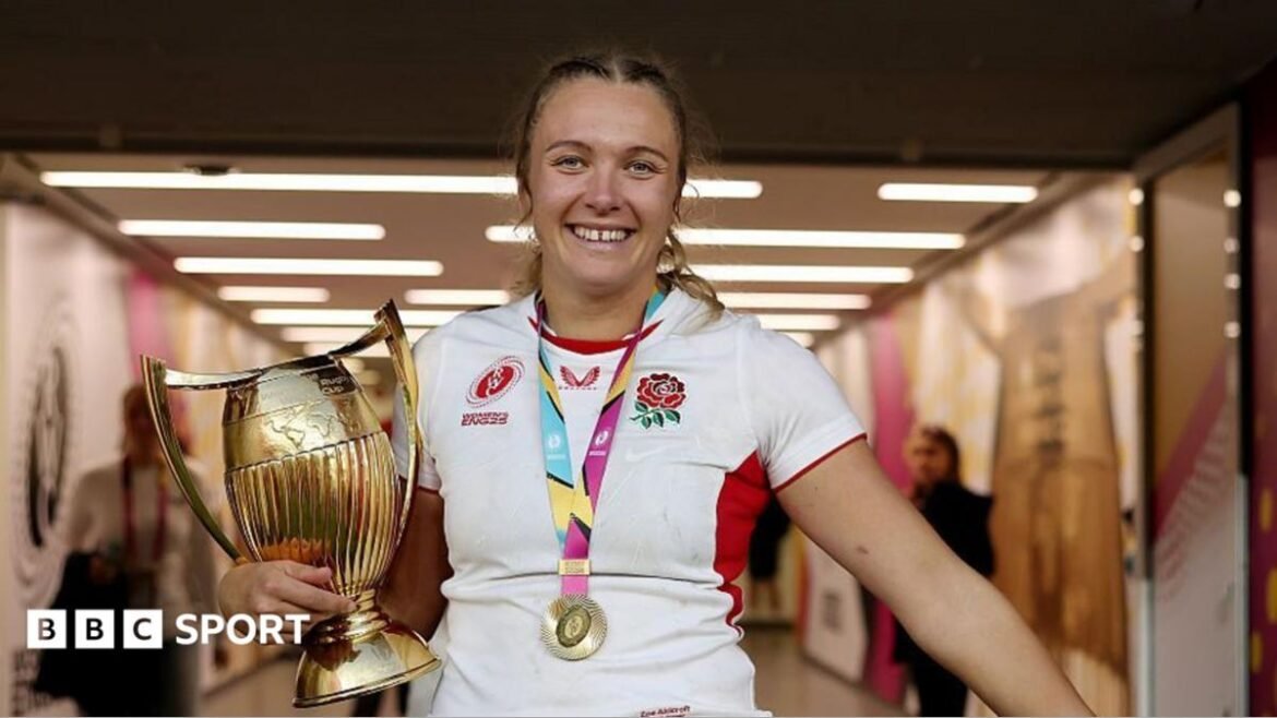 England's Zoe Stratford celebrates with the World Cup trophy 